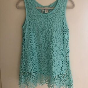 Gently worn. I call the color “Ocean glass”. The back is split which is so cute!